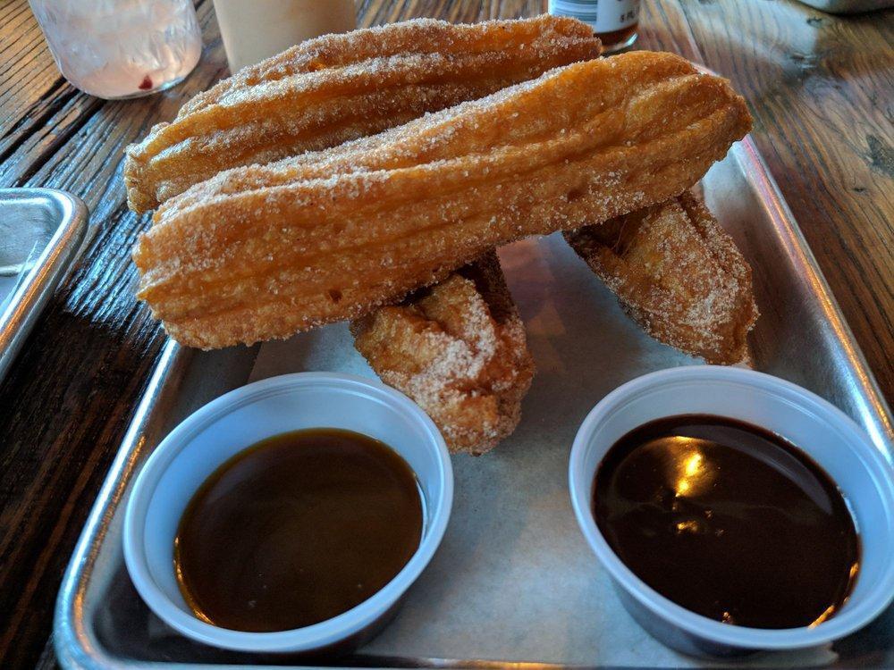 Churros · House-Made Fried Churros Rolled in Cinnamon Sugar served with Chocolate Mole and Caramel Dipping Sauce.