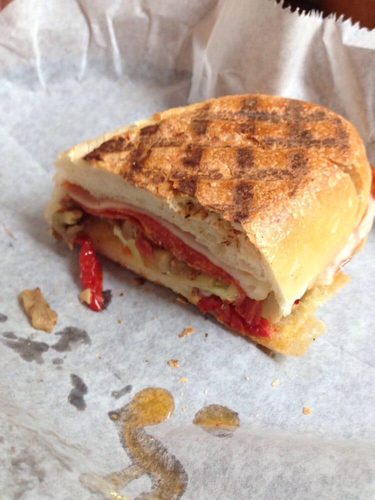 The Sicilian Panini · Marinated eggplant, mushrooms, artichokes with salami, sun-dried tomatoes, provolone cheese and spicy olive oil. Served with chips.