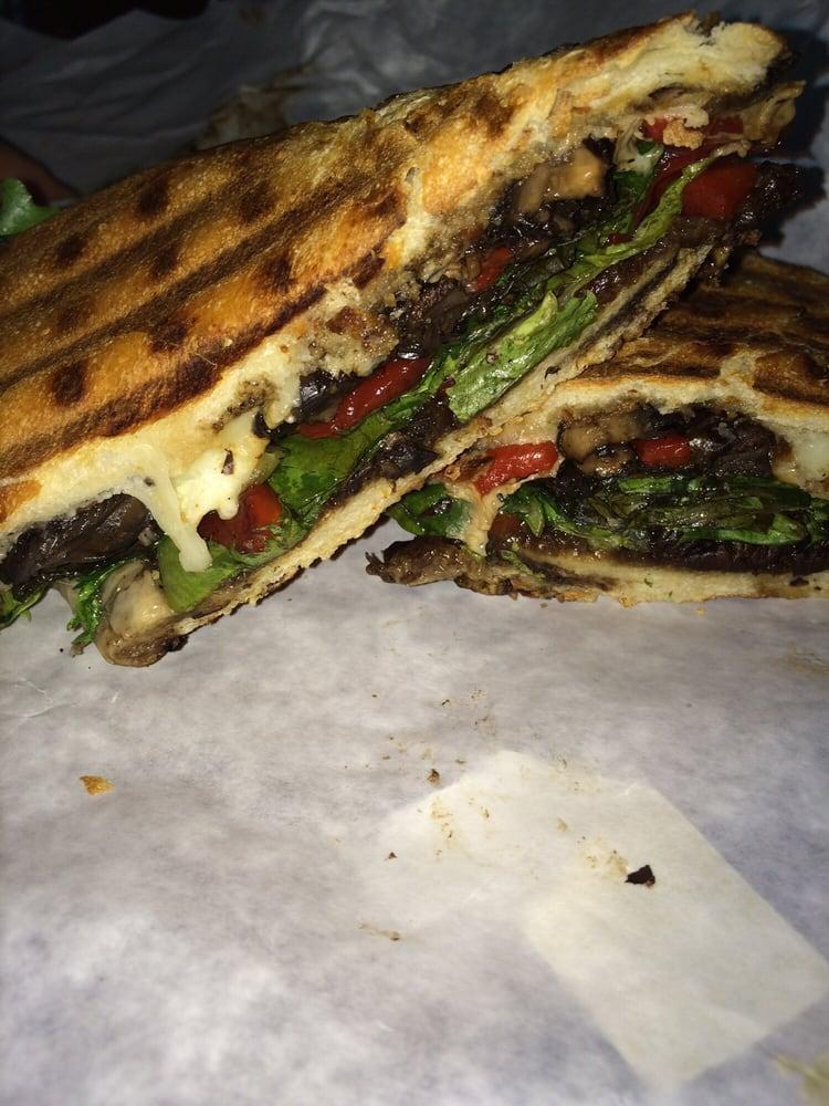 The Portobello Panini · Grilled portobello, roasted peppers with field green and provolone. Served with chips.