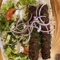 Lamb Kabob Plate · Charbroiled seasoned tender lamb topped with parsley. Served with basmati rice and house sal...