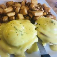 Eggs Benedict Special · Split English muffin, Canadian bacon, 2 poached eggs topped with creamy hollandaise sauce, s...