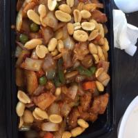 Kung Pao Chicken · Sliced chicken stir fried with water chestnut, carrot, peas, jalapeno and onion in spicy bro...