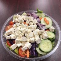 Greek Salad · Romaine lettuce, tomatoes, onions, cucumbers, olives pepperoncini, carrots, feta cheese, gre...