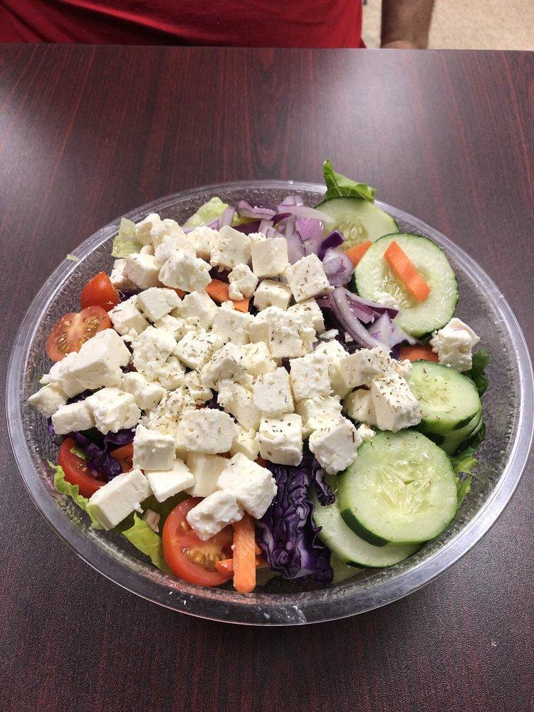 Greek Salad · Romaine lettuce, tomatoes, onions, cucumbers, olives pepperoncini, carrots, feta cheese, green peppers and choice of dressing.