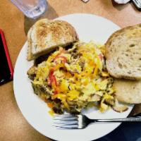 Country Scramble · Scrambled eggs, tomato, onion, bell pepper, cheddar; scramble with choice of bacon, sausage ...
