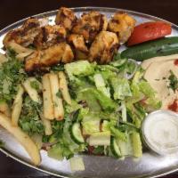 Kabob-shish Tawook · Marinated charbroiled chicken breast with pepper and tomato.