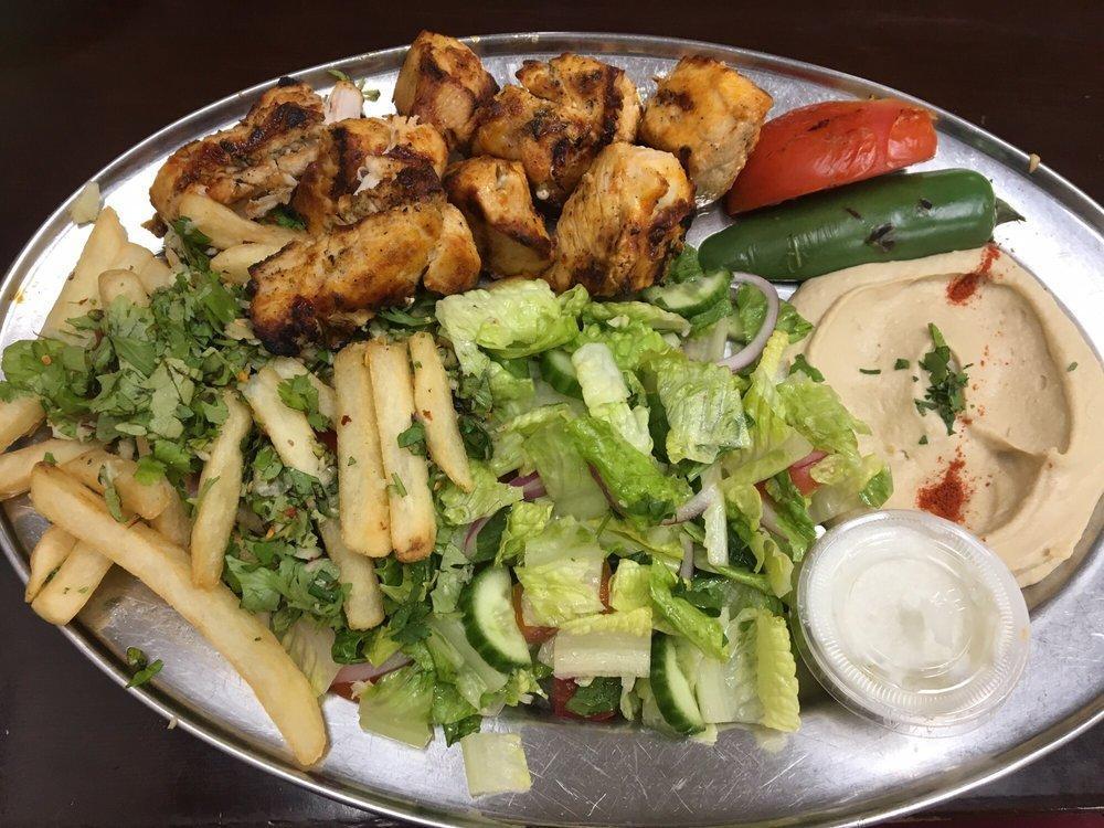 Kabob-shish Tawook · Marinated charbroiled chicken breast with pepper and tomato.