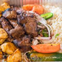 Mix Grill · Approx 30 oz. of beef filet, kafta and tawook served on a bed of rice with grilled tomatoes ...