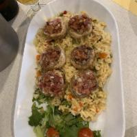 Stuffed Mushrooms · 4 large mushrooms, stuffed with bacon and mozzarella cheese over rice.