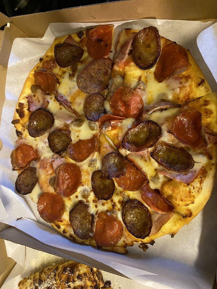 Caveman Pizza · Pepperoni, ground beef, Canadian bacon and Italian sausage