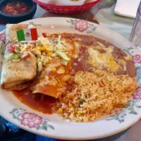 Enchilada · 2 corn tortillas rolled and filled with your choice of shredded beef, shredded chicken or gr...