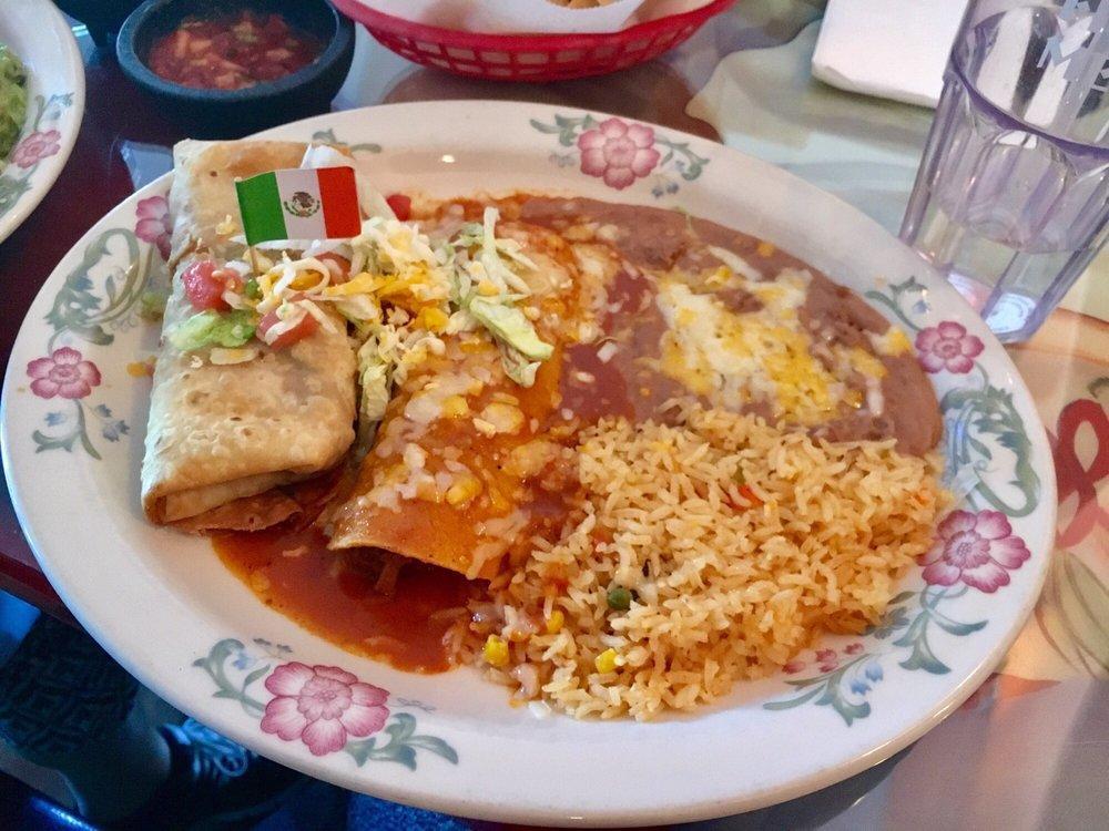 Enchilada · 2 corn tortillas rolled and filled with your choice of shredded beef, shredded chicken or ground beef topped with our red enchilada sauce and melted cheese garnished with coleslaw.