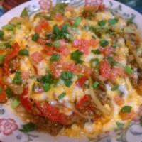 Queso Fundido · Sauteed mushrooms, red and green bell peppers, onions and ground beef topped with melted che...