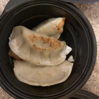 Potstickers · Chicken dumplings served with a soy dipping sauce.