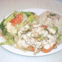 Chicken Shawarma Plate · Grilled marinated chicken breast served with rice, tahini rice, salad, sauteed vegetables an...