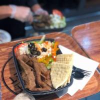 Gyro Platter · Your choice of protein, greek salad, tzatziki sauce, and gyro pita bread.