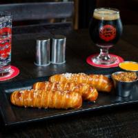 Icon Pretzel · Handcrafted Bavarian style pretzel served with AIB Factory Pilsner beer cheese and Icon IPA ...