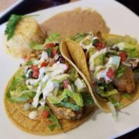 Beer Battered Avocado · House made beer battered avocado with a side of sour cream.