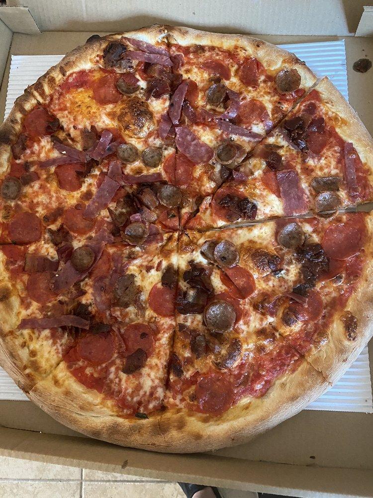 Meat Lovers Pizza · Tomato sauce topped with pepperoni, soppressata salami, bacon and sausage, and mozzarella.