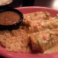 Chile Rellenos · Three crispy rellenos filled with Cheddar and Monterey Jack. Smothered with New Mexico Hatch...