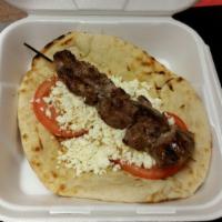Beef Souvlaki Sandwich · Grilled chunks of beef served on pita bread with lettuce, tomatoes, feta cheese, and homemad...