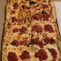 Grandma Pizza · 8 slices. Thin Sicilian crust brushed with olive oil & garlic, fresh mozzarella, and spotted...