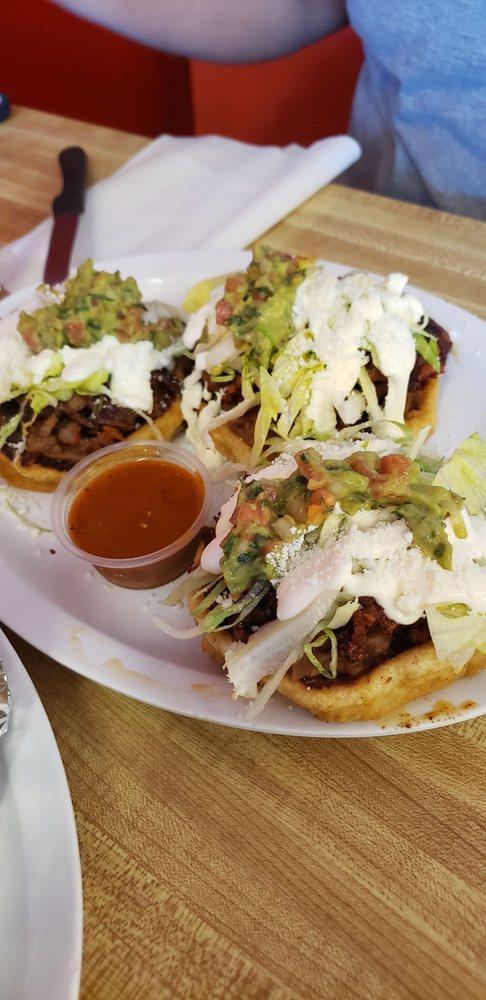 Sope · The smaller one shown. Comes with lettuce, cheese, beans, or guacamole sour cream.
