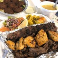 Triple Meat Combo · Beef shawarma, kefta kabob, chicken kabob.