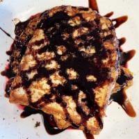 Rocky Road French Toast · Thick cut challah loaf, vanilla ice cream, chocolate sauce, marshmallows, peanuts and mini j...
