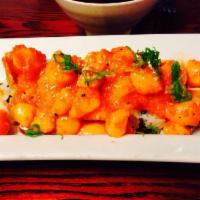The Kobe Roll · In: shrimp tempura, cream cheese, avocado, spicy tuna, out: spicy scallop, green onion. Spicy.