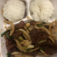 Mongolian Beef · Served with salad and rice.