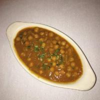 Chana Masala · A north Indian specialty of chickpeas cooked with onion, tomatoes and spices. 