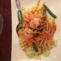 Papaya Salad · A popular Thai salad, som tum consists of fresh shredded green papaya, carrot, tomato and gr...