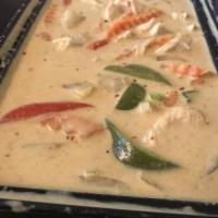 Yellow Curry · Thai spices blended in chili paste with pineapple, bell pepper, onion and carrots simmered i...