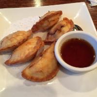 Crab Rangoon · Crispy wonton filled with a rich cream cheese, kamaboko crab, cranberry, onion and celery, s...