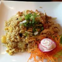 Pineapple Fried Rice · Stir fried rice with egg, onion, pineapple, raisin, cashew nut and curry powder.