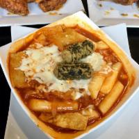 Tteokbokki · Chewy rice cakes, fish cakes and onions, stir-fried in a Korean red pepper sauce topped with...