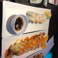 Alaska Roll · Smoked salmon, avocado, crab stick with masago on top & served with ponzu sauce.