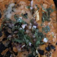 Crab and Shrimp Salpicon Enchilada Suizas · Roasted tomato cream sauce, house cheese blend, tortilla strips, crumbled pasilla chilis, re...
