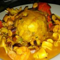 Mariscofongo · Seafood over smashed green plantain