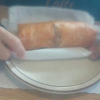 Sausage Burrito · 4 pieces of sausage, 2 eggs, hashbrown, and cheddar cheese all wrapped in a large flour tort...