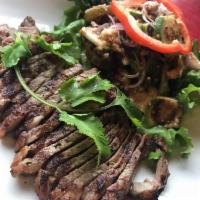 Beef Anchovies Salad · Grilled steak, Thai eggplant, pickled jalapenos, black olives and scallions in house special...
