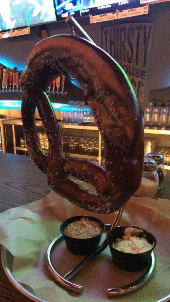 Bavarian Pretzel · A giant Bavarian pretzel, salted and served with our house made Guinness grain mustard and Boursin beer cheese. 