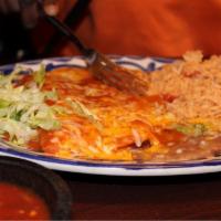 Grilled Salmon and Green Cheese Enchilada · A flavorful grilled salmon filet served with a Jack cheese enchilada smothered with our savo...