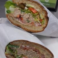 Tuna Salad Sandwich · Tuna salad, cucumber, pepperoncini, red onion, shredded carrots, lettuce and tomato with mus...