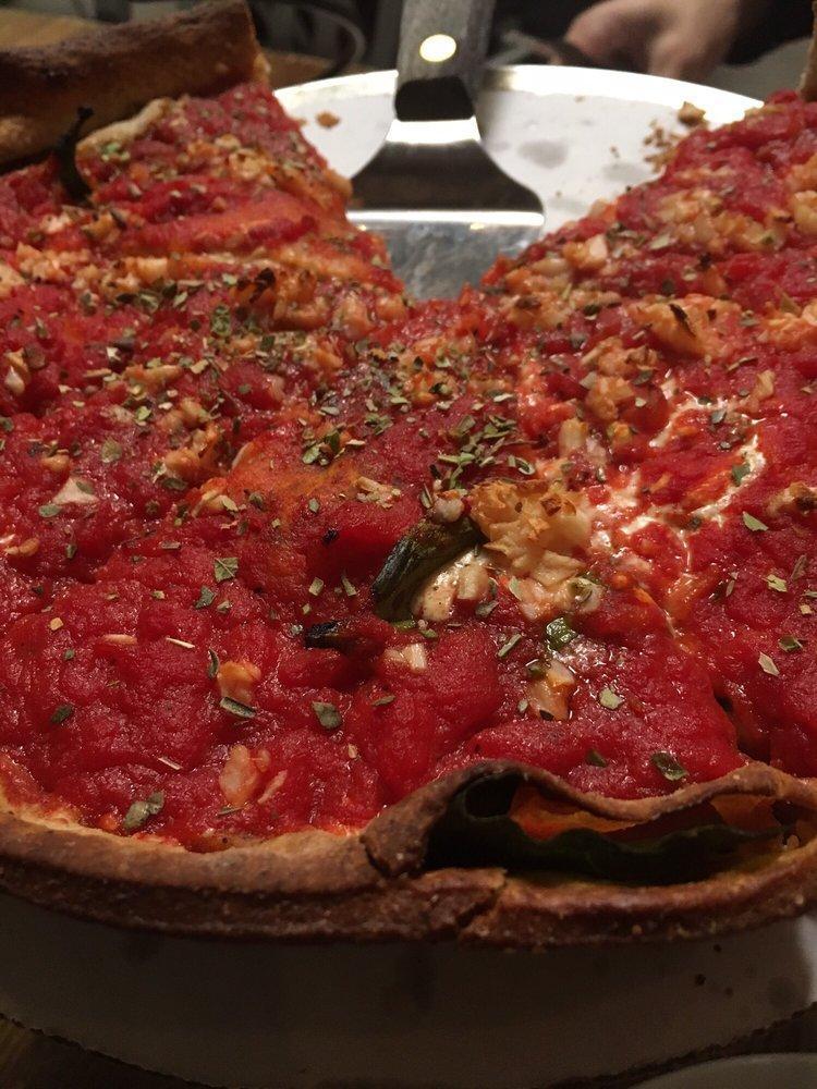 Vegan Pizza · Whole wheat crust, fresh spinach, fresh garlic, red onion, and daiya vegan cheese. Deep dish pizza topped with a thin layer of extra dough and homemade tomato sauce. Vegan.