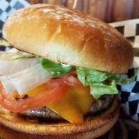 The Pub Burger · Our 1/2 lb patty with a blend of Angus and Wagyu beef. Topped with lettuce, tomato, pickles,...