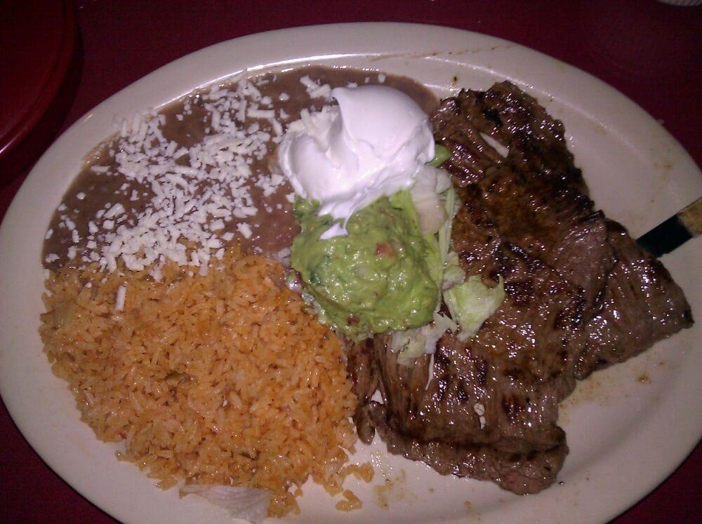 Carne Asada · Grilled skirt steak, served with rice, beans, sour cream and guacamole.