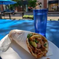 Traditional Chicken Gyro · Just like in Greece! Hand-stacked marinated chicken topped with tomatoes, red onions, romain...