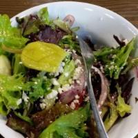 Greek Salad · Arcadian spring mix, romaine, Roma tomatoes, cucumbers, red onions, Kalamata olives, crumble...